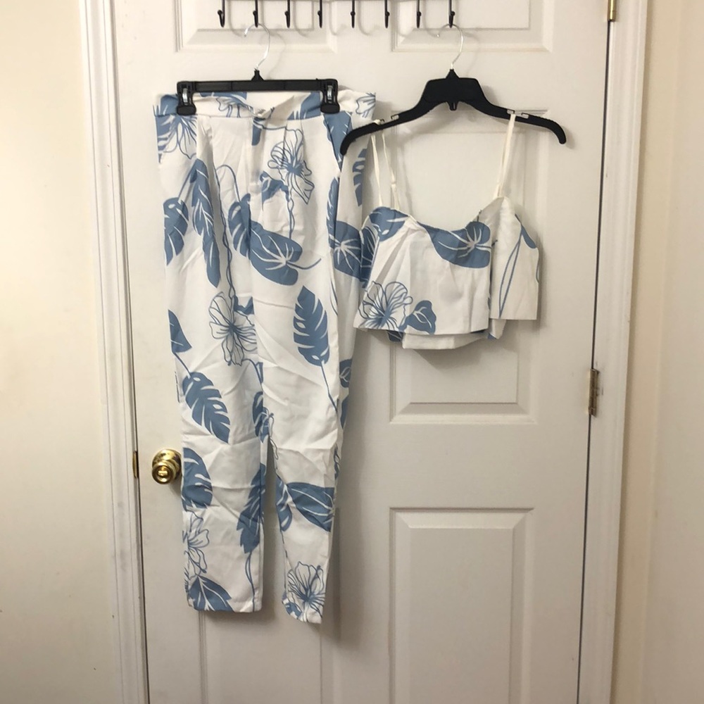 Blue two piece outfit. Crop top and pants.